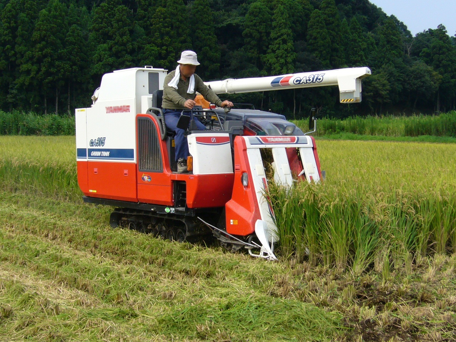 A Yanmar rice combine harvester working in Katori, Chiba